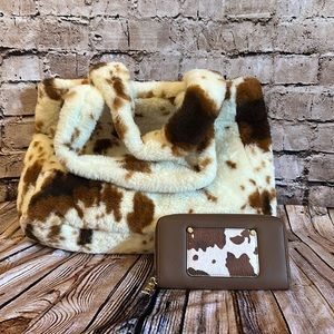 Brown cow print fuzzy matching purse and wallet